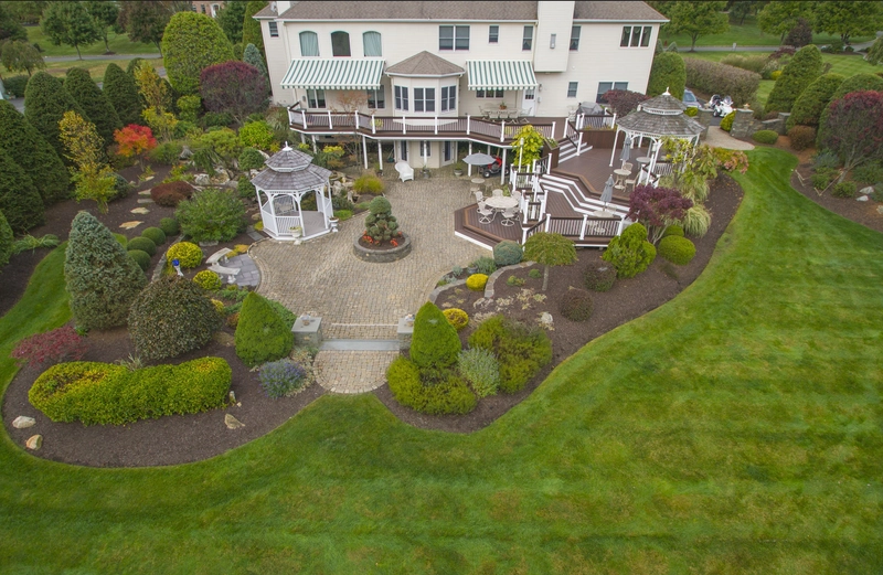 Professionally designed residential landscape that combines planting beds and outdoor living spaces in New Jersey
